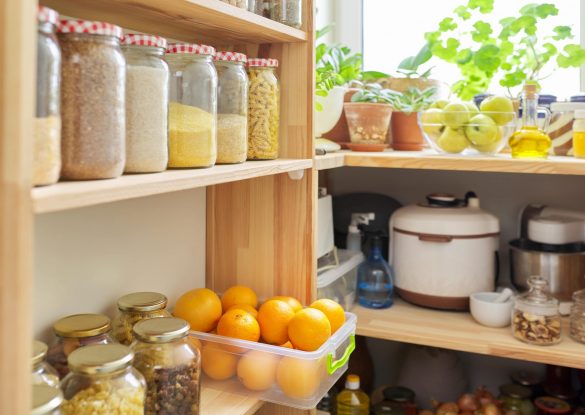 kitchen pantry wooden shelves with jars containers with food food storage jars cereals container oranges kitchen utensils houseplants min scaled